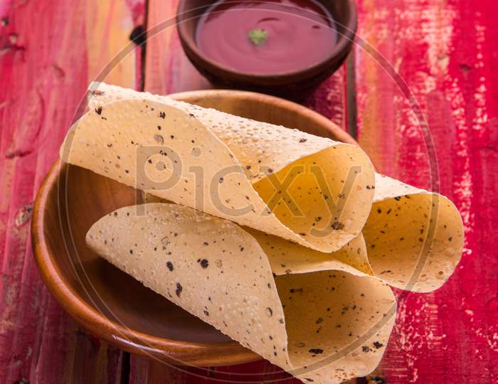 Roasted papad roll is a popular side dish In Indian Lunch/Dinner