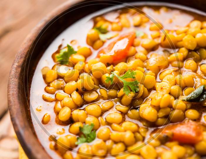 cooked Chana Dal fry or Split Bengal Gram tadka served in a bowl or pan, selective focus