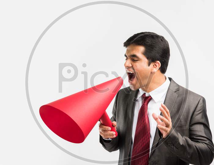 Indian young businessman announcing in paper speaker