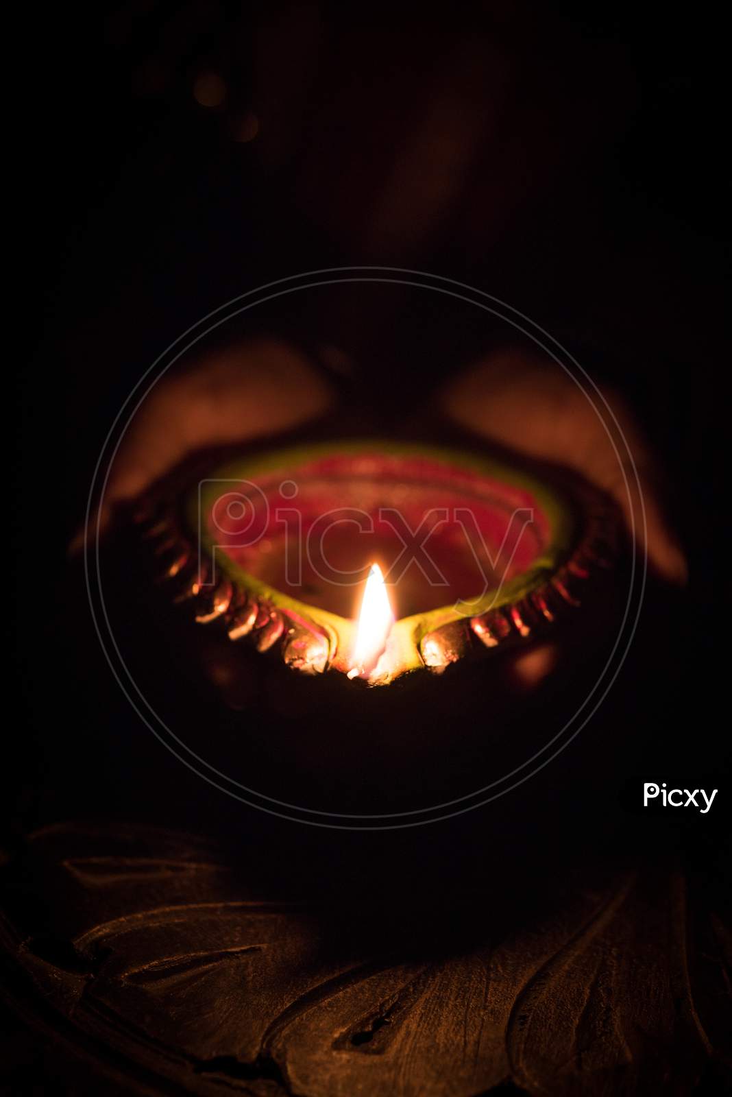 diwali diya in hands