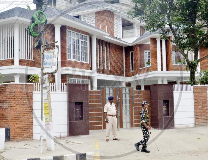 Security personnel stand guard in front of The residence of Chief Justice of India Ranjan Gogoi