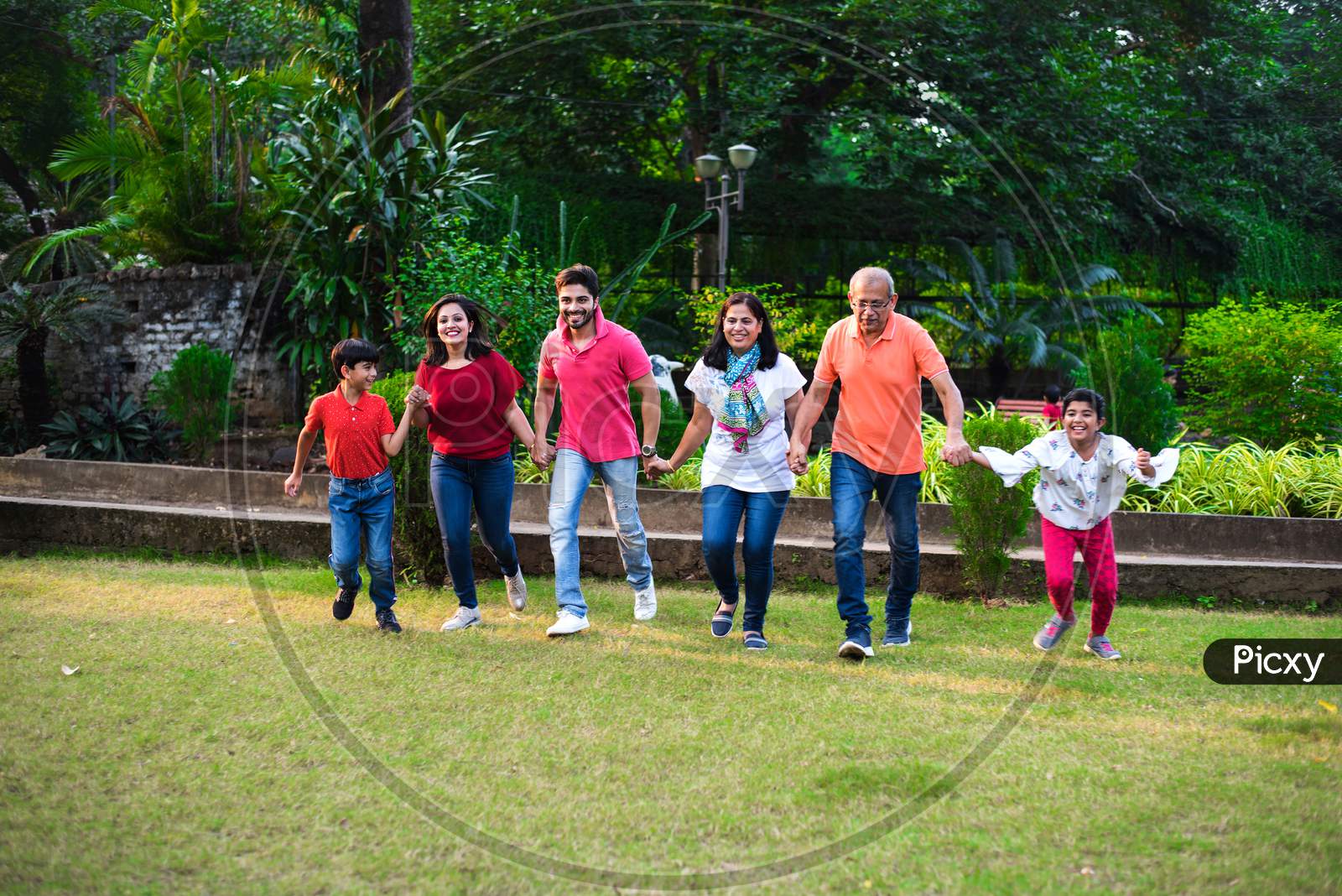 indian family playing outdoor game or walking
