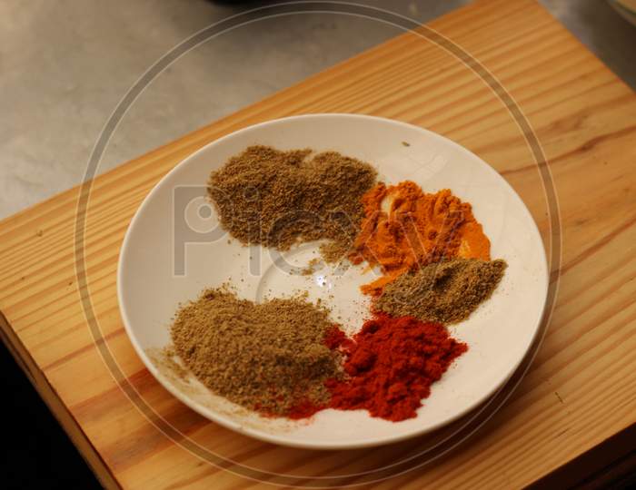 Indian spices on a white plate