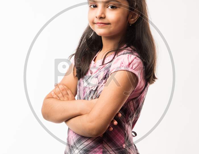 Portrait of a cute 7 years old girl Isolated over white background Stock  Photo