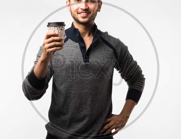 Man having coffee in paper cup