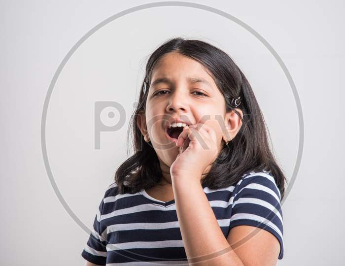 Cute little girl having tooth ache or dental problem
