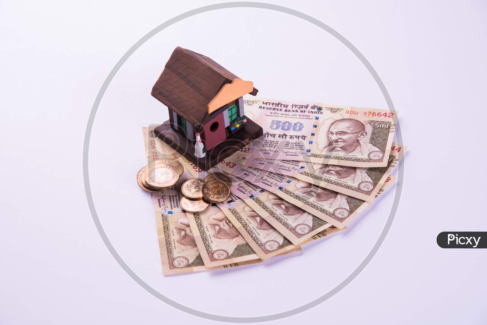 Indian Real Estate Finance and Housing Loan or buying concept showing Rupees, 3D house model, calculator etc
