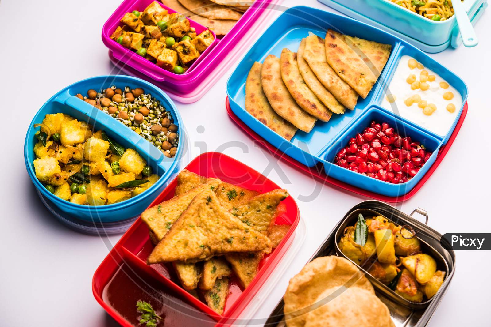 group of Lunch Box / Tiffin for Indian kids, showing variety or multiple option or combination of healthy food for your school g