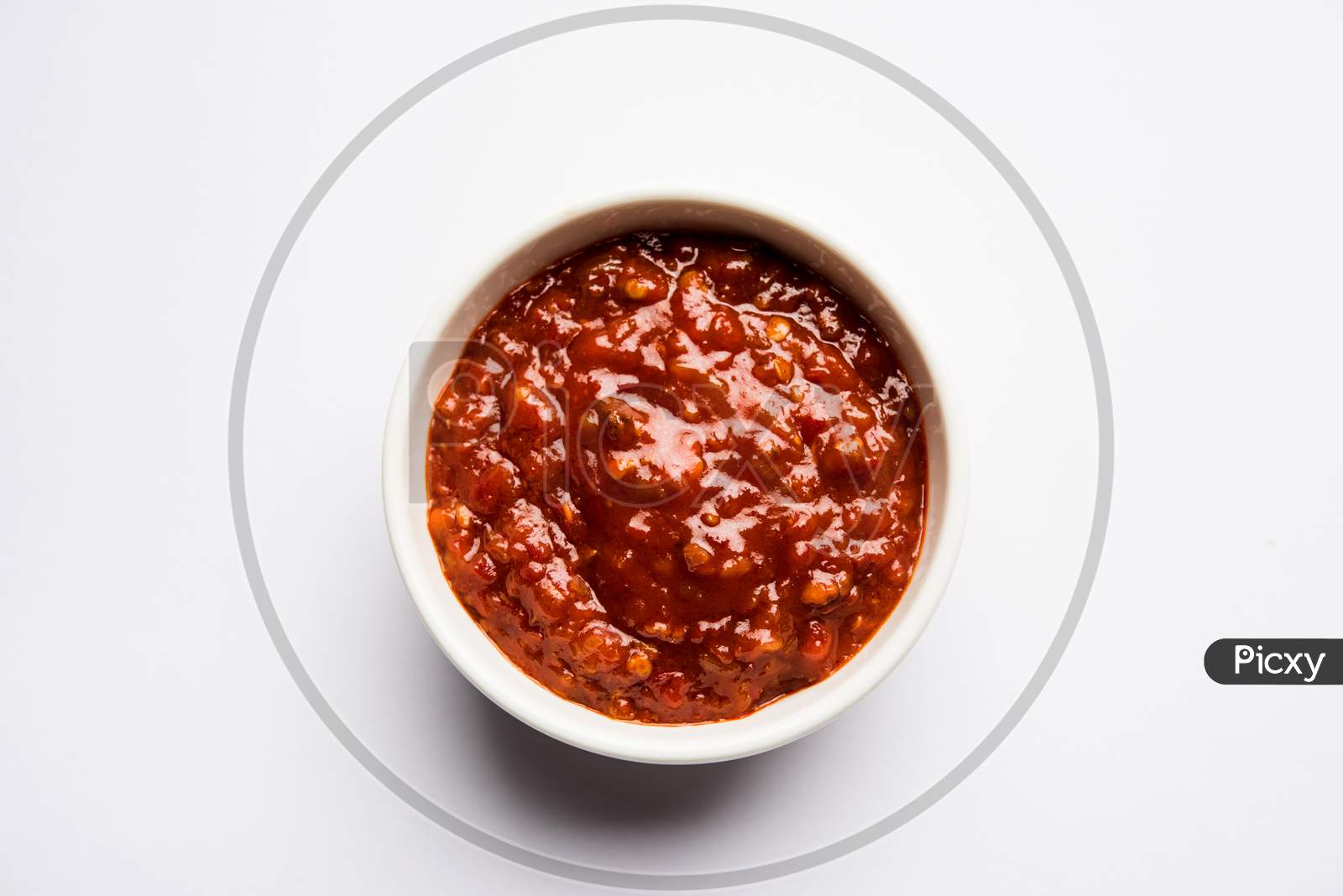 Schezwan Sauce / Szechuan chutney is an important ingredient in Chinese recipe. served in a bowl, isolated.  selective focus