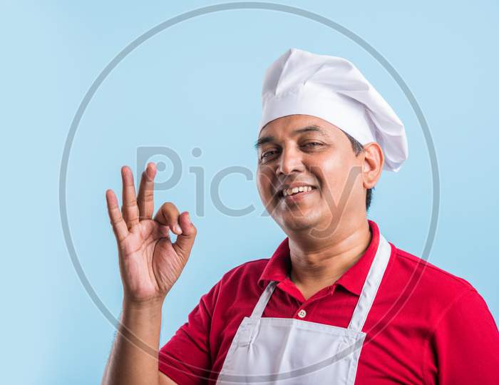 Image Of An Indian Chef With Soup Bowls And With An Expression On An Isolated White Background 