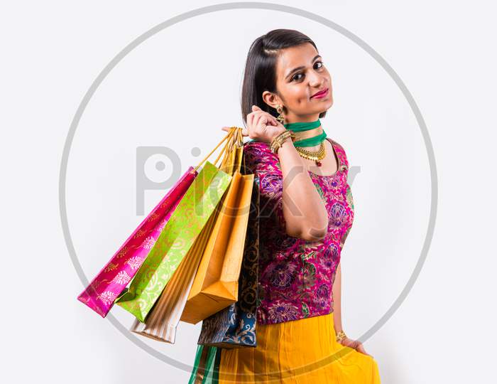 Girl with shopping bags and debit / credit card
