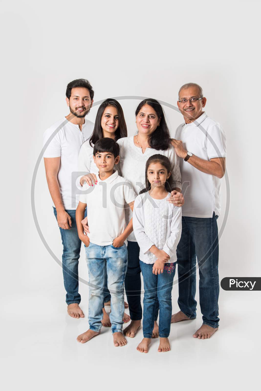 Indian family standing isolated over white background
