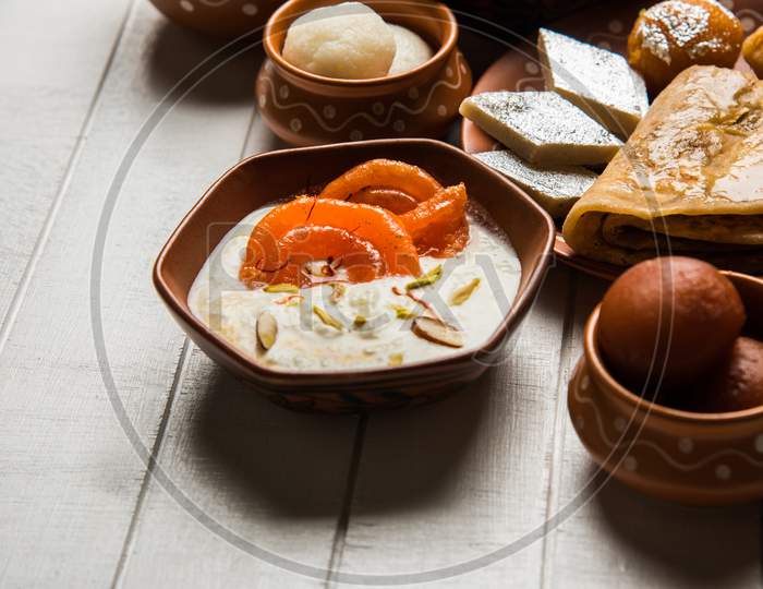 group of Indian Sweet / mithai in terracotta bowl