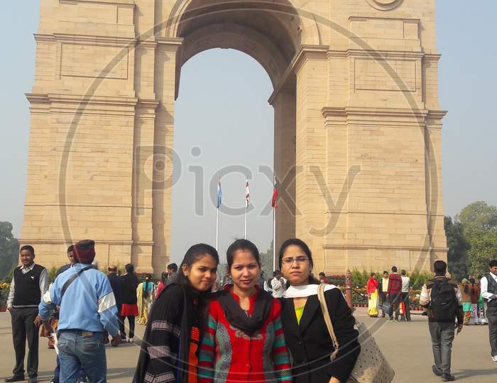 Indian girls together at background India gate