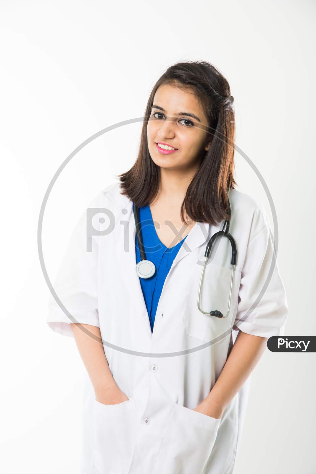 Indian/asian Female Doctor with stethoscope, standing isolated over white background over white background
