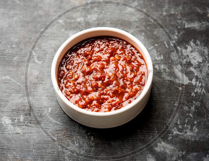 Schezwan Sauce / Szechuan chutney is an important ingredient in Chinese recipe. served in a bowl, isolated.  selective focus