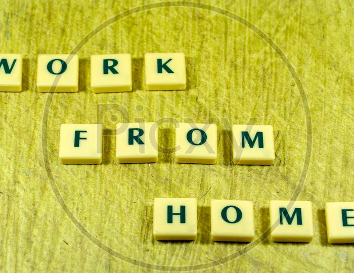 Work from home word concept texture background image using by block letter with Disposable surgical face mask cover the mouth and nose