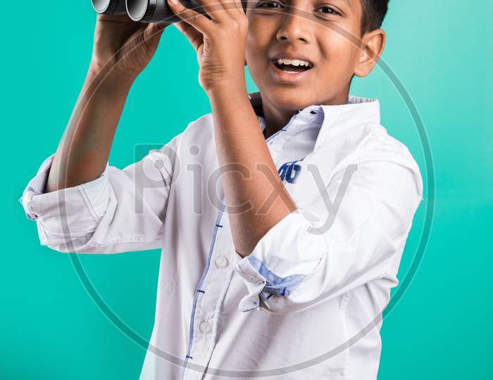 School kid looking through binocular