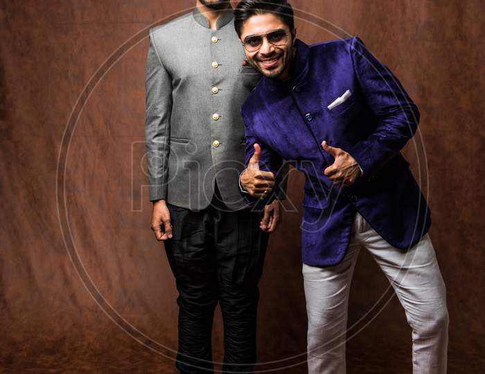 Two male models wearing sherwani / jodhpuri or kurta pyjama