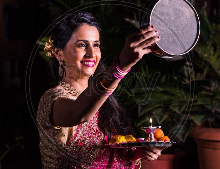 Young wife celebrating karwa chauth festival