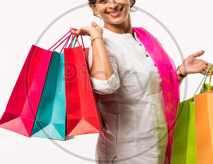 Indian lady/women with shopping bag, standing isolated over white background