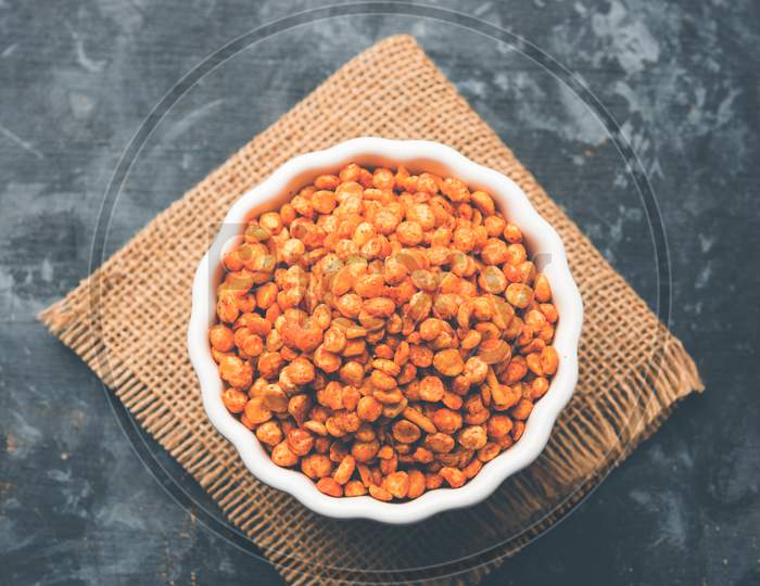 Fried and Spicy Chana Dal Masala is a popular Chakna recipe. served in a bowl. selective focus