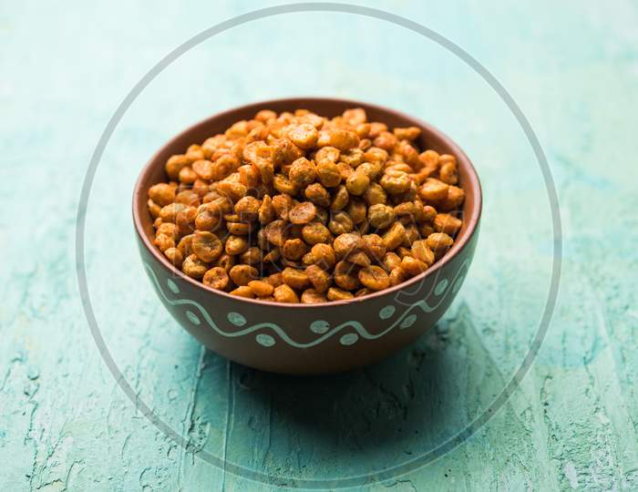 Fried and Spicy Chana Dal Masala is a popular Chakna recipe. served in a bowl. selective focus