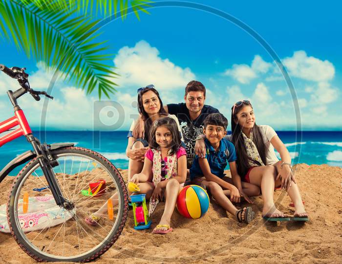 young indian family at beach