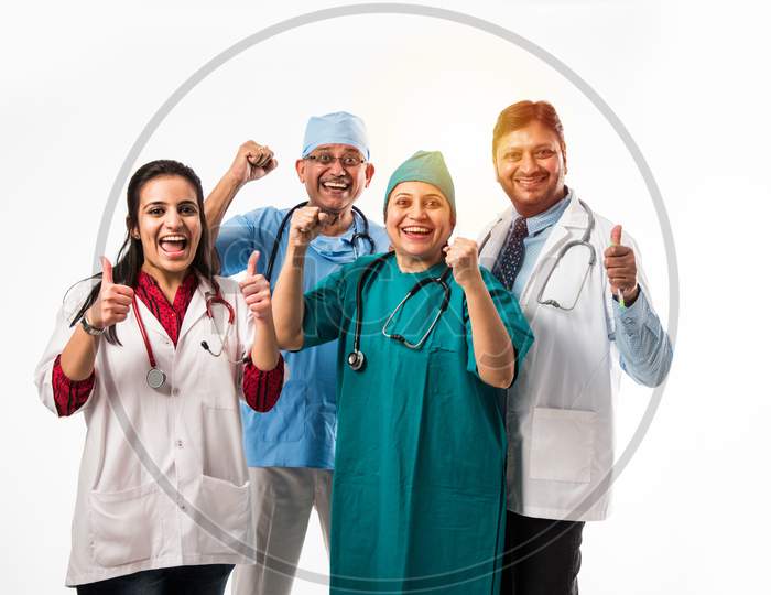group of Indian doctors showing success sign or thumbs up