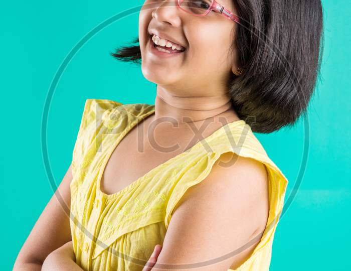 cute little happy Indian girl wearing clear glasses or Spectacles