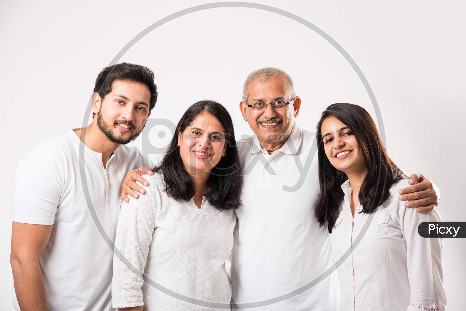 happy Indian family of 4 standing isolated over white background