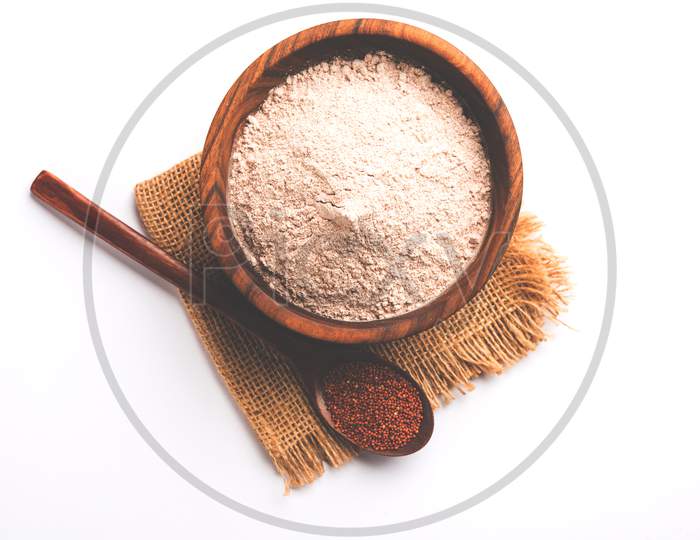 Raw Ragi or Nachni grain with powder