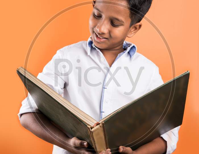 School kid reading big book