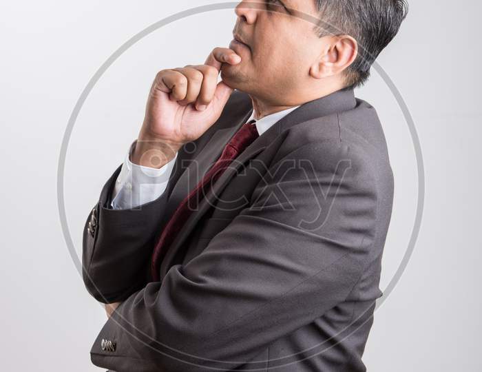 Indian handsome Businessman thinking