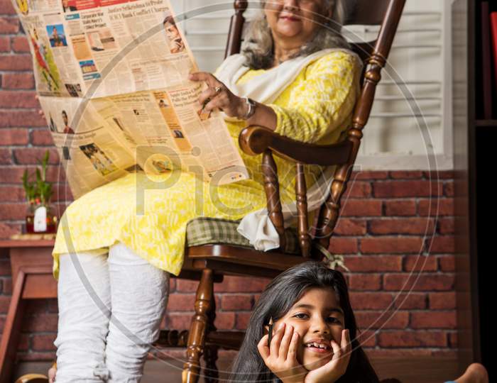 Happy moments with grandma, indian/asian senior lady spending quality time with her grand daughter