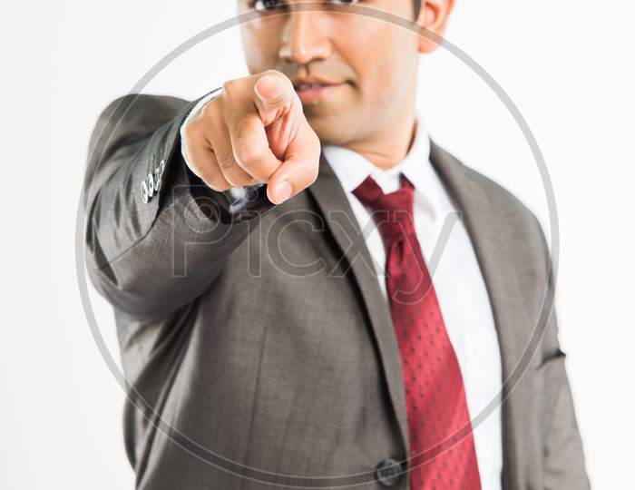 Indian young businessman pointing