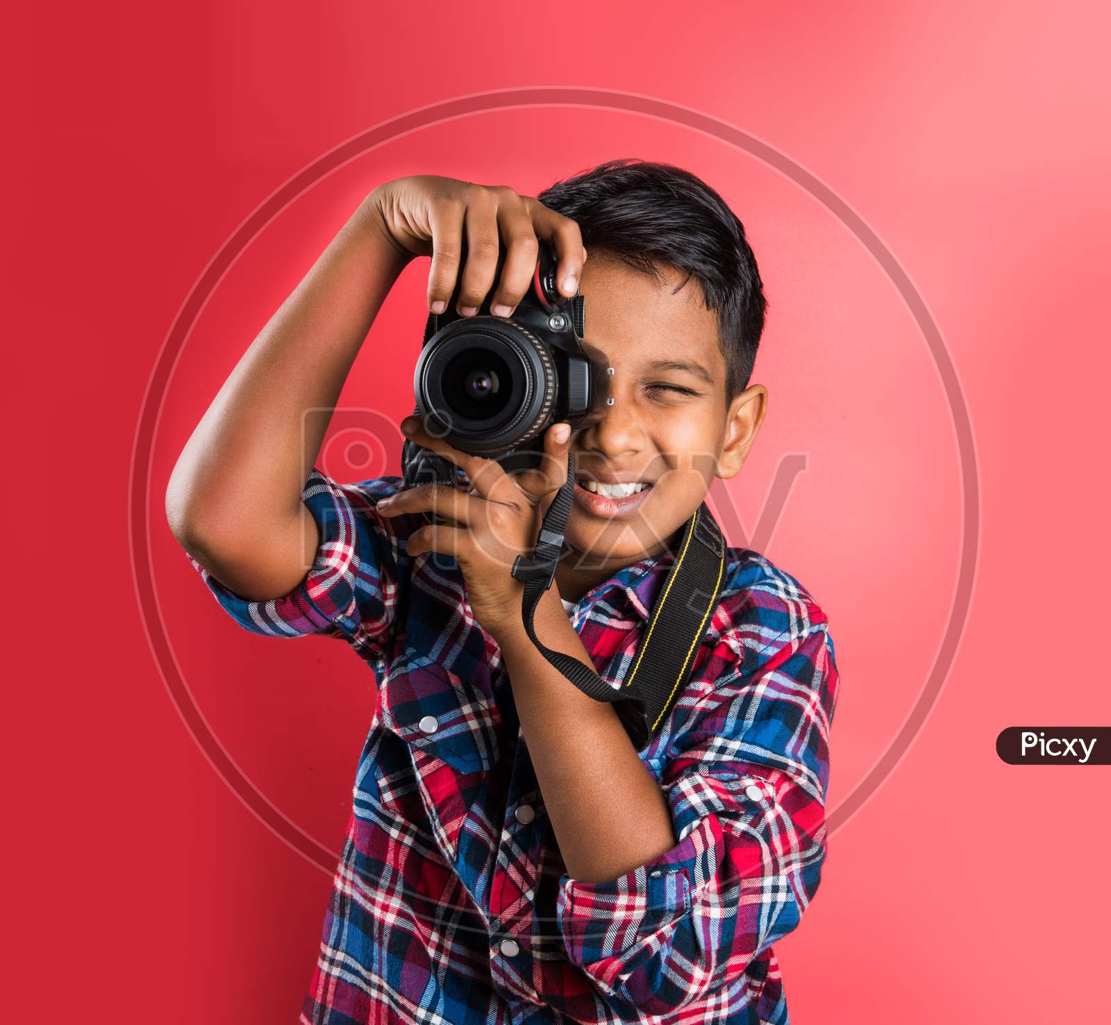 Image of small boy taking pictures with Digital Camera-DP313804-Picxy