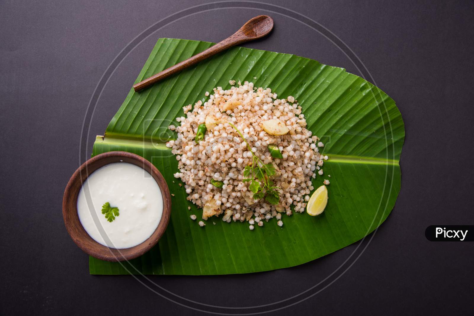 Sabudana Khichadi Or Khichdi served over coconut leaf