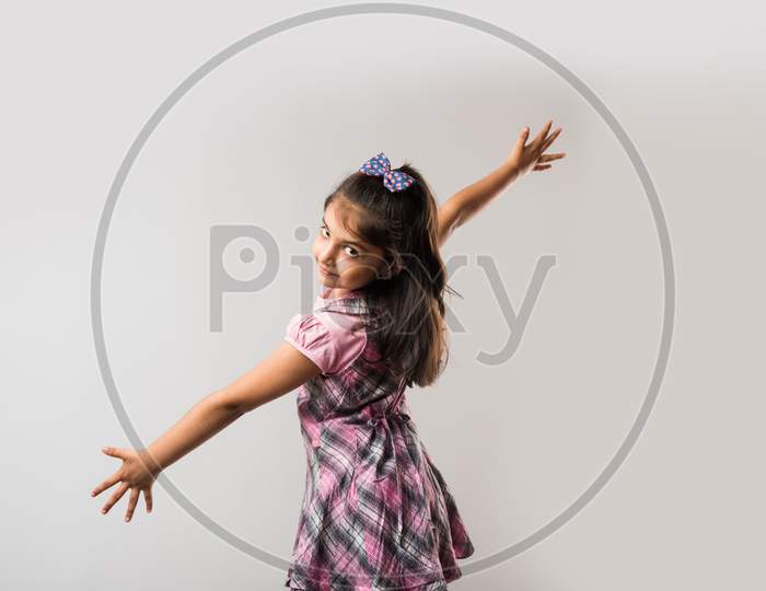 Portrait of Cute little girl isolated over white background
