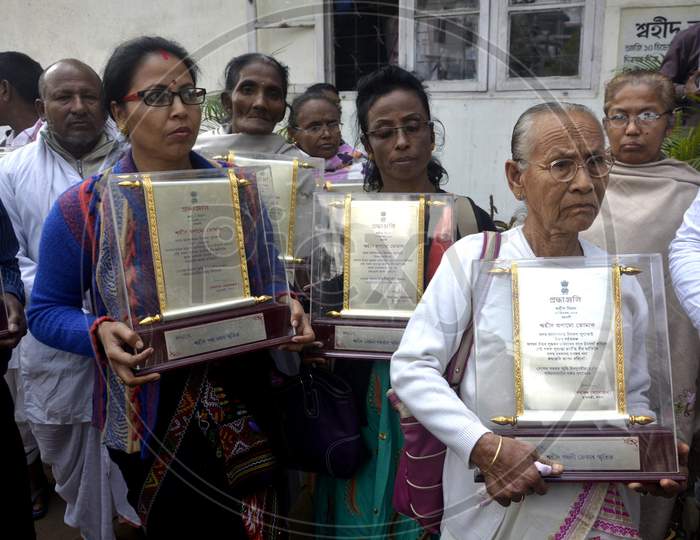 Family members of Assam Movement martyrs returning their honored  trophy to Government