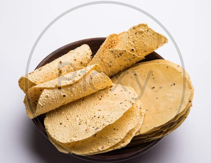 Image of Gujarati papad or papadum in raw dried form with roasted cone ...