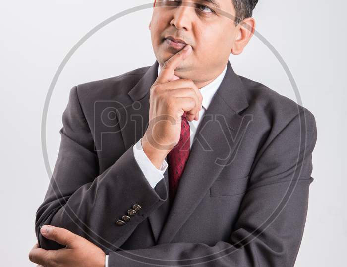 Indian handsome Businessman thinking