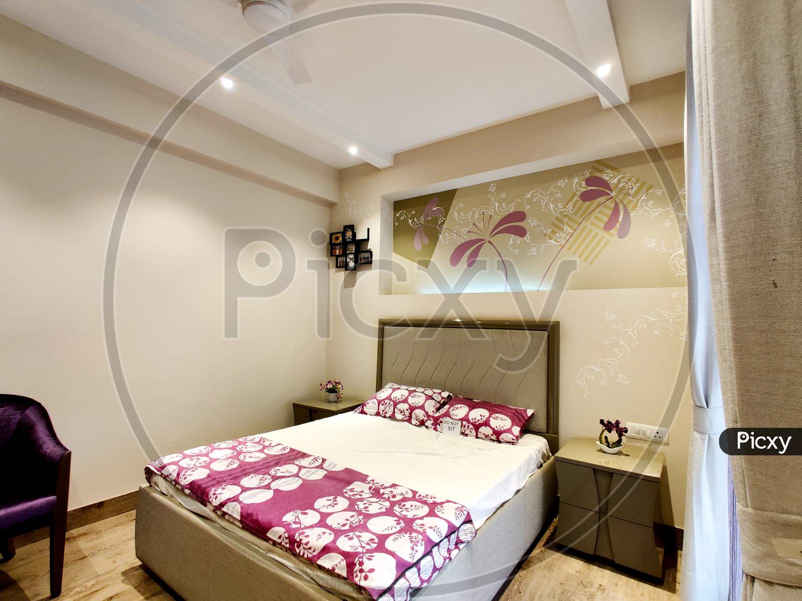 Wide Angle Shot Of A Modern Well Designed Bedroom With Great Lighting
