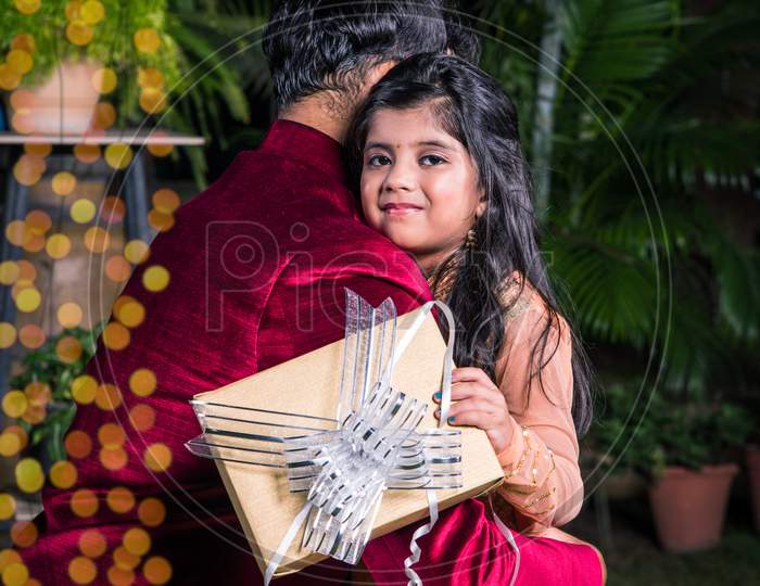 Indian father and daughter celebrating diwali festival