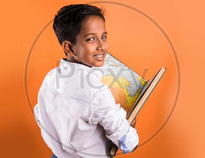School kid reading big book