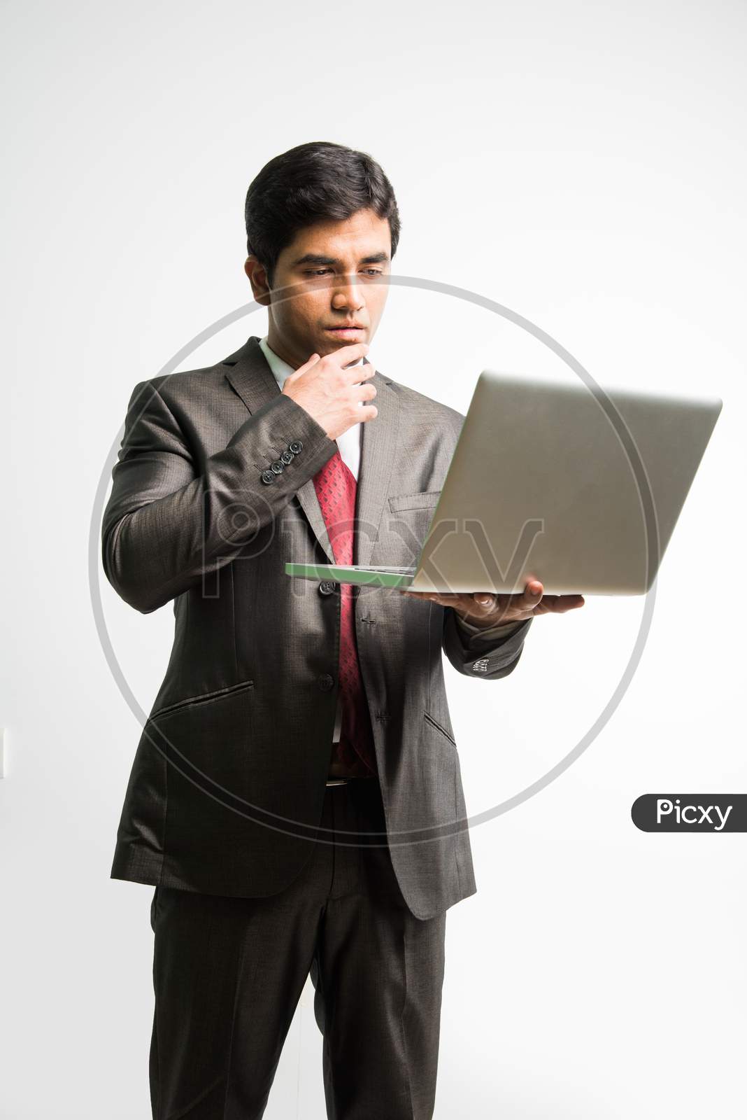 Indian young businessman with laptop computer