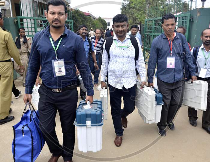 Polling officials leave after collecting Electronic Voting Machines (EVM)