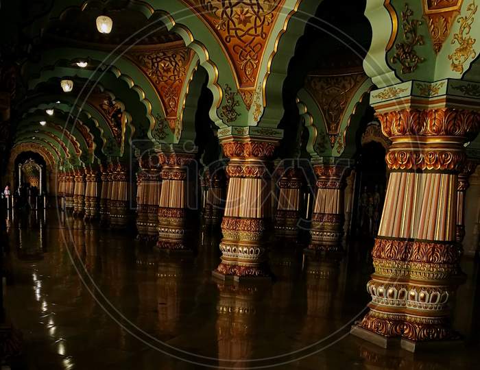 Pillars of a palace and its reflection on the floor with beautiful architecture work