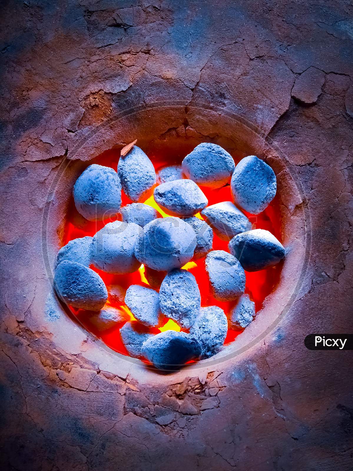 Earthen Stove. Traditional Indian Cooking With An Charcoal Earth Oven In Rural Village. Coal Fire Burning Close Up.