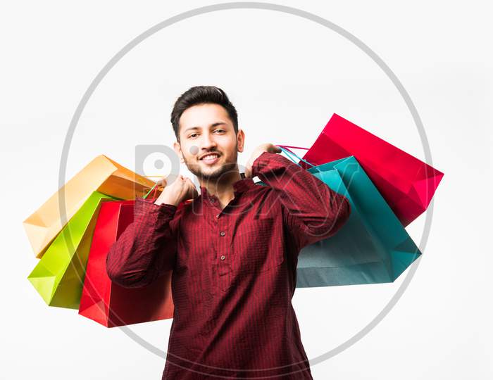 Indian/asian man with shopping bags
